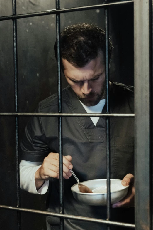 a man eating from a bowl in a jail cell, trending on reddit, square, ( ( theatrical ) ), h3h3, best chef