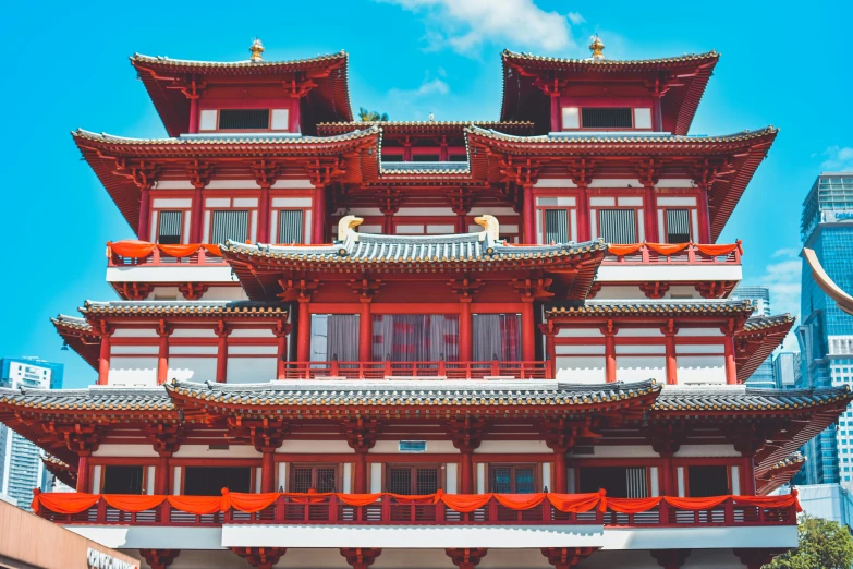 a tall building in the middle of a city, pexels contest winner, cloisonnism, red and white color scheme, temple background, red trusses, 🦩🪐🐞👩🏻🦳