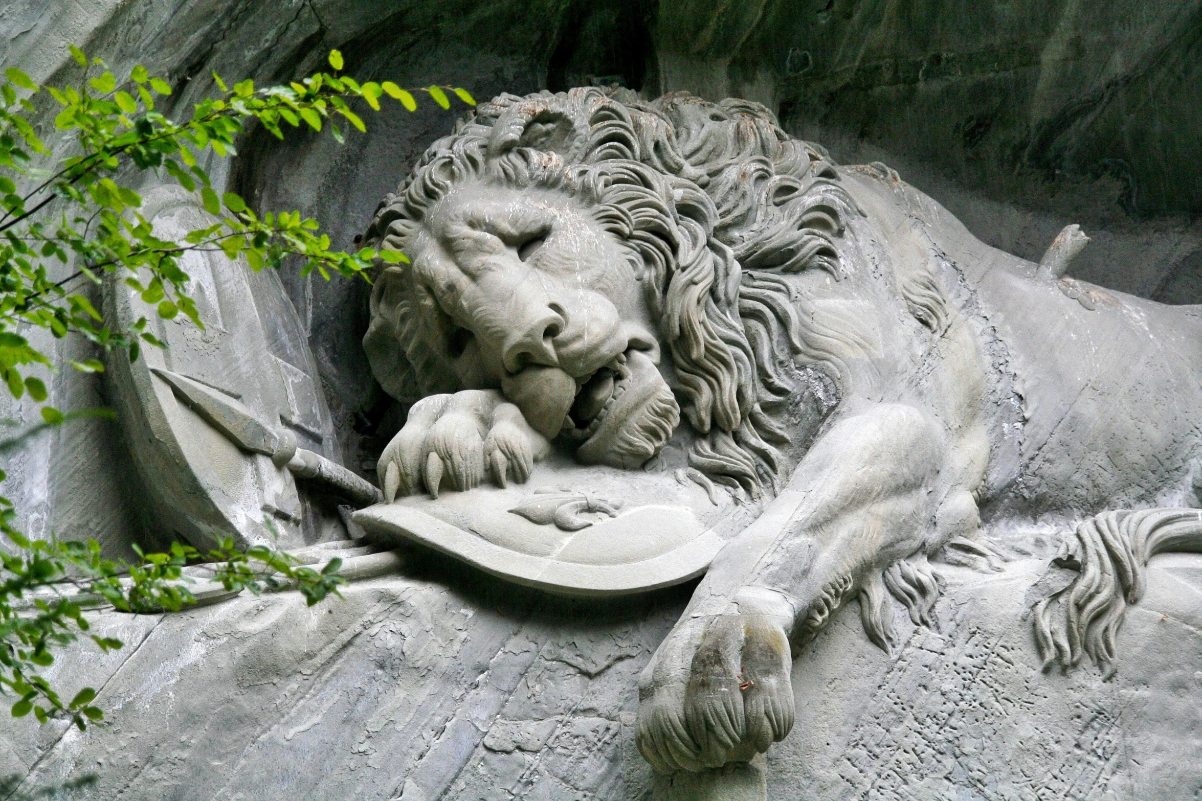 a statue of a lion laying on top of a rock, a statue, inspired by Gustav Doré, pexels contest winner, stone grotto in the center, sleepers, milan schere, grey