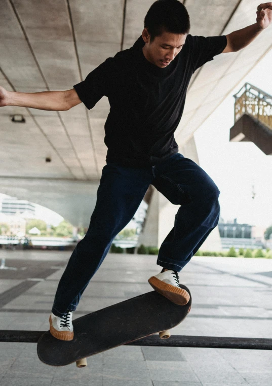 a man flying through the air while riding a skateboard, pexels contest winner, happening, wearing a dark shirt and jeans, trending on r/techwearclothing, concerned, baggy black pants