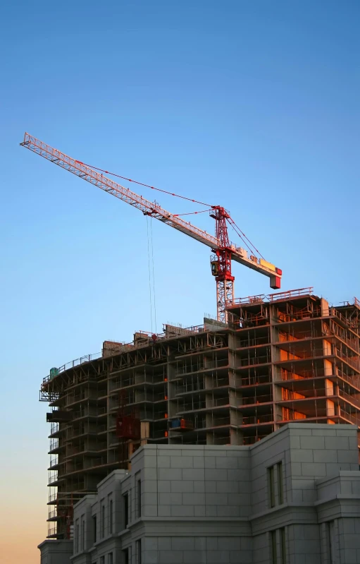 a crane that is sitting on top of a building, flickr, getty images, 2995599206, mixed development, multiple stories