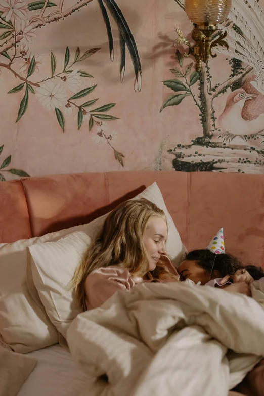 a woman laying in bed with a dog, a cartoon, inspired by Frieke Janssens, trending on pexels, wearing a party hat, with a kid, ellie bamber fairy, shot from cinematic