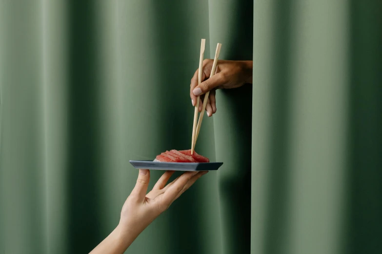 a person holding chopsticks over a plate of food, inspired by Kaigetsudō Ando, curtains, matte surface, deep green, handcrafted