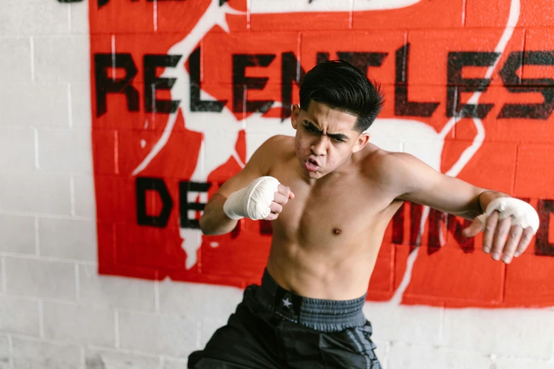 a shirtless young man in a boxing stance, by Robbie Trevino, background image, asher duran, evan lee, white bandages on fists