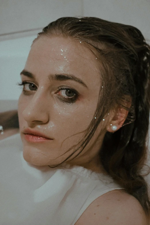 a woman taking a bath in a bathtub, an album cover, inspired by Elsa Bleda, trending on pexels, renaissance, glitter makeup, natalia dyer, headshot profile picture, white freckles