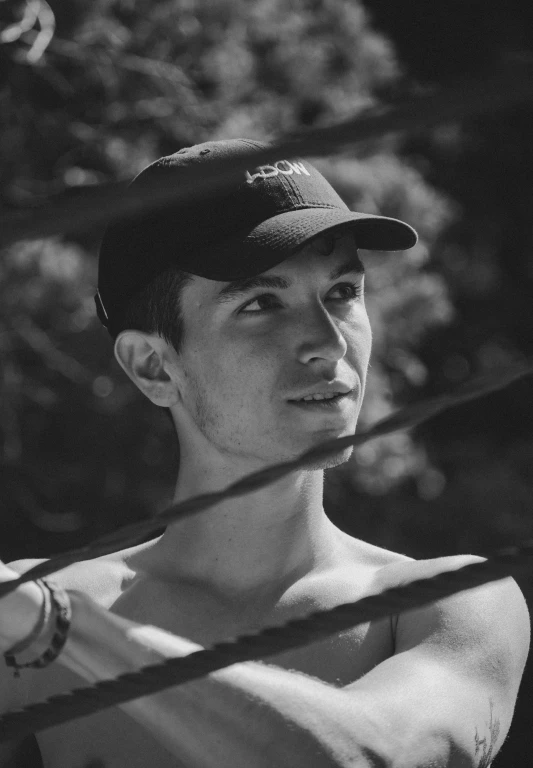 a black and white photo of a man holding a baseball bat, inspired by Ludovit Fulla, realism, discord profile picture, covered in vines, black hat, shirtless