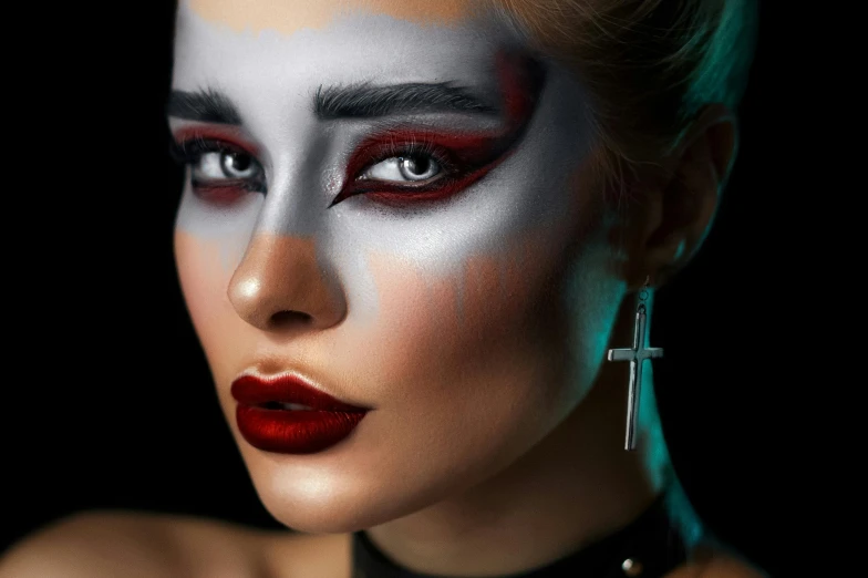 a woman with a cross painted on her face, an airbrush painting, trending on pexels, gothic art, high cheekbones, classic kabuki, crimson themed, beauty blade runner woman