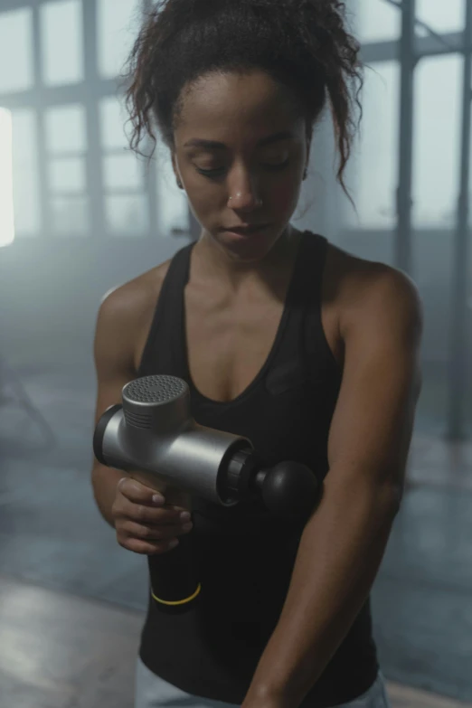 a woman holding a hair dryer in a room, lifting weights, hypersphere, sidefx houdini, grey metal body