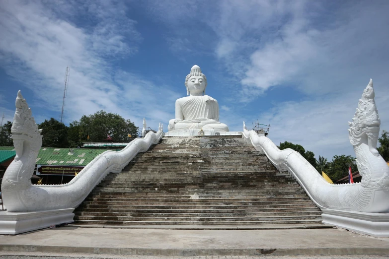 a large white statue sitting on top of a set of steps, patiphan sottiwilai, avatar image, square, concrete
