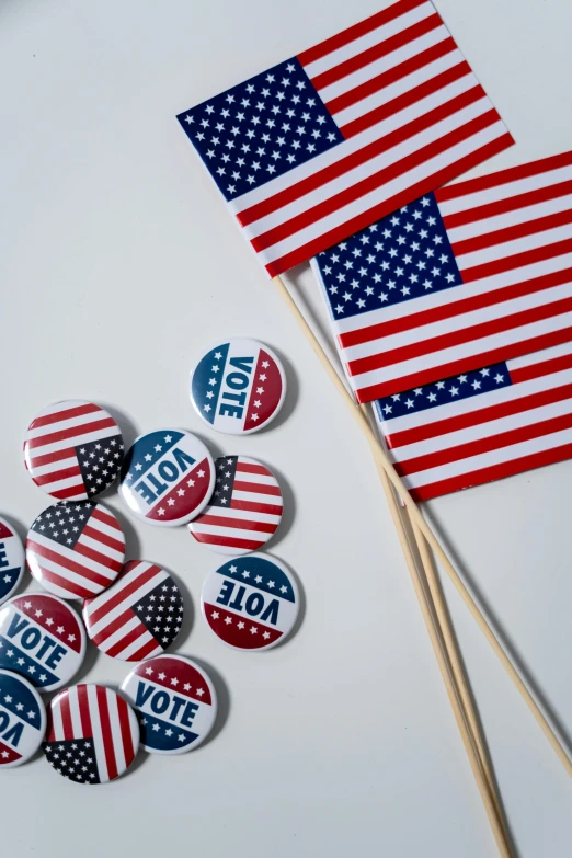 a bunch of buttons sitting on top of a table, a picture, american flags, profile image