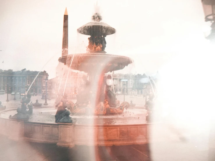 a close up of a fountain with a building in the background, a statue, by Daniel Gelon, pexels contest winner, with red haze, crowded square, transparent background, paris background