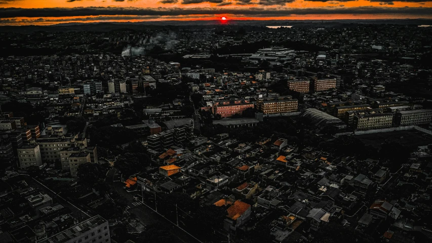 an aerial view of a city at sunset, an album cover, by Alejandro Obregón, pexels contest winner, japanese town, sunset dark dramatic day, high quality image, buildings covered in black tar