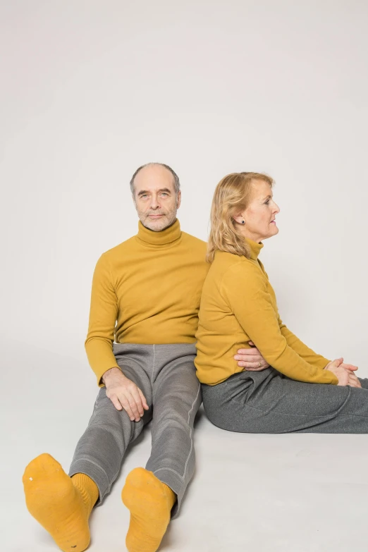 a man and a woman sitting next to each other, by Anna Füssli, antipodeans, turning yellow, 5 0 years old, casual clothing, head straight down