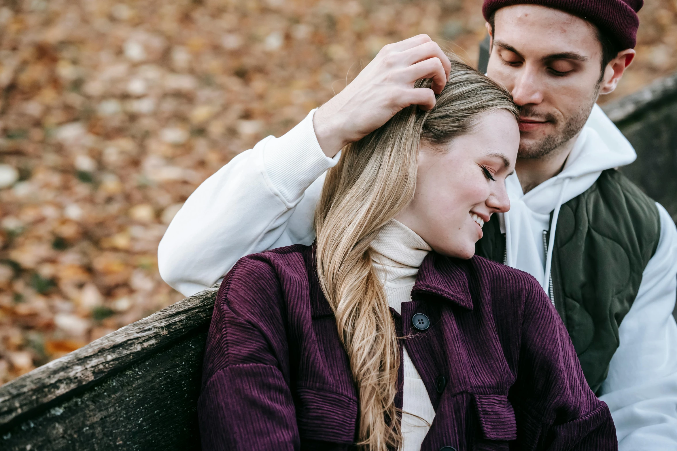 a man and a woman sitting on a bench, a photo, by Emma Andijewska, trending on pexels, renaissance, wearing a purple breton cap, autumnal, her hair flowing down, thumbnail