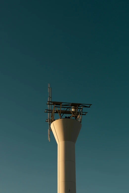 a large air traffic control tower under a blue sky, unsplash, postminimalism, shot with sony alpha, low sun, thirst, white