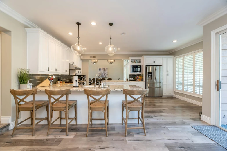 the kitchen is clean and ready for us to use, by Robbie Trevino, pexels contest winner, light and space, real estate photography, profile pic, hardwood floor, 1 4 9 3