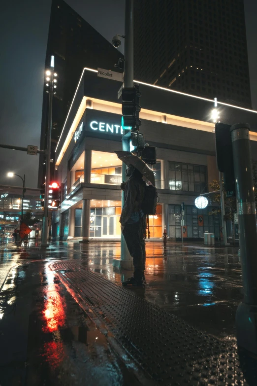 a person holding an umbrella on a rainy night, by Dan Content, context art, standing in a city center, cinestill eastmancolor, cinematic unreal 5, instagram post