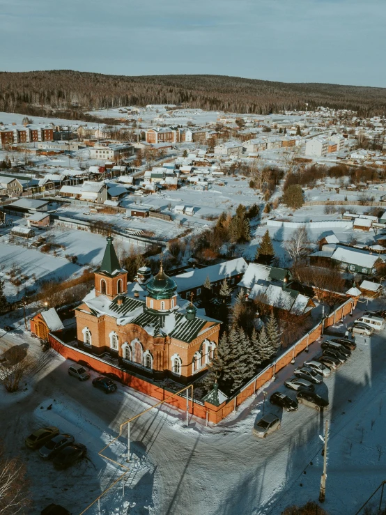 an aerial view of a town in the winter, inspired by Isaac Levitan, pexels contest winner, russian temple, fpv, square, high res 8k