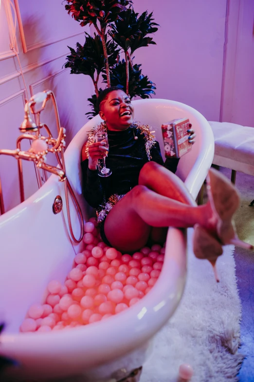 a woman sitting in a bathtub filled with balls, trending on pexels, renaissance, chillin at the club together, lady kima, champagne, thicc