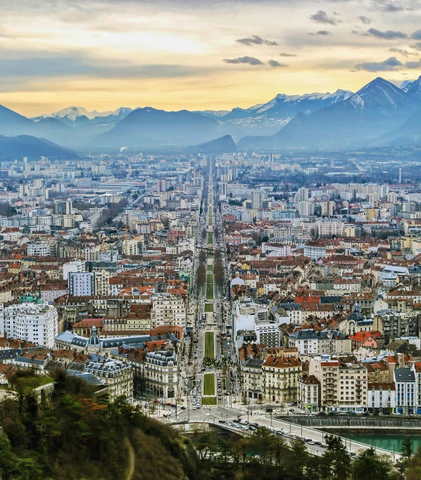 a view of a city with mountains in the background, by Sven Erixson, pexels contest winner, art nouveau, high view, square, van, “the ultimate gigachad