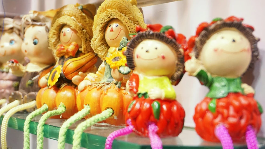 a group of figurines sitting on top of a shelf, during autumn, candy decorations, profile image, market in japan