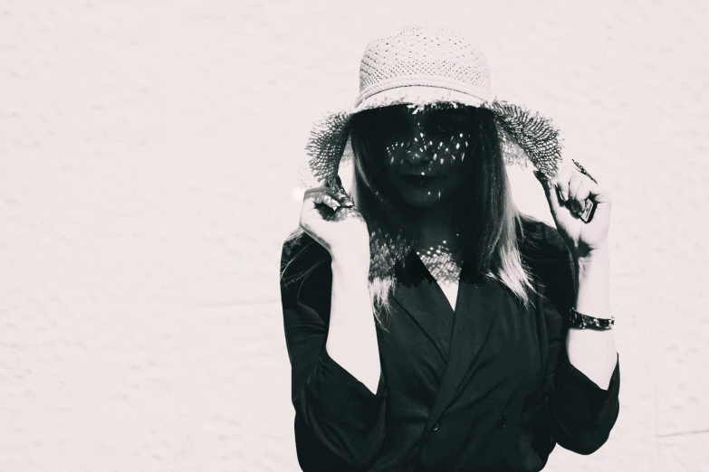 a black and white photo of a woman wearing a hat, a black and white photo, unsplash, aestheticism, masked, overexposed, in clothes! intricate, ((oversaturated))