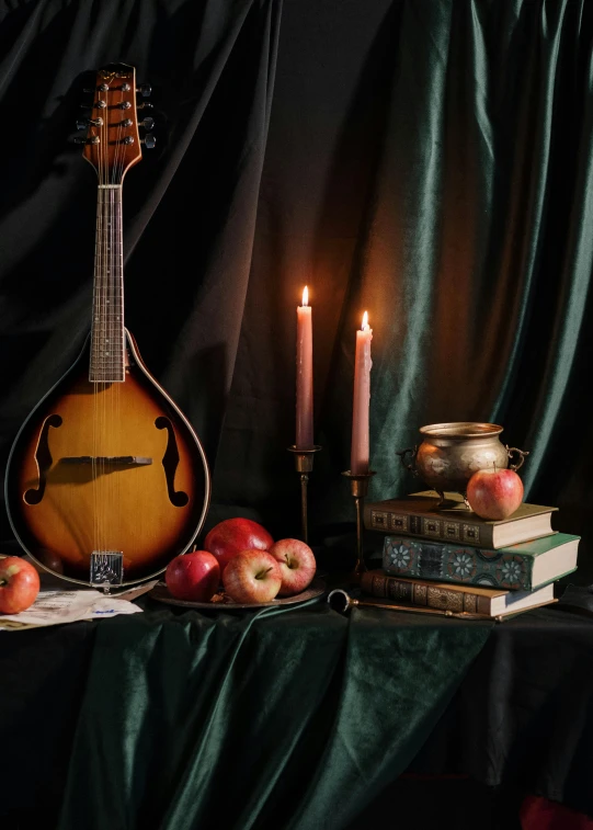 a guitar sitting on top of a table next to a pile of books, a still life, inspired by William Michael Harnett, unsplash contest winner, baroque, candlelight, playing a mandolin, still life of an apple, studio shot