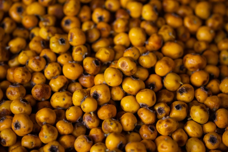 a pile of chickpeas sitting on top of each other, by Thomas Häfner, hurufiyya, made of bees, yellow colours, background of poison apples, sichuan