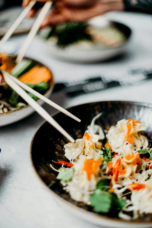 a close up of a plate of food with chopsticks, unsplash, happening, banner, beautiful details, grey, bowl filled with food