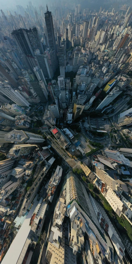 an aerial view of a city with lots of tall buildings, by Patrick Ching, pexels contest winner, photorealism, low angle fisheye view, 8 k hyper detailed image, kakar cheung, instagram post