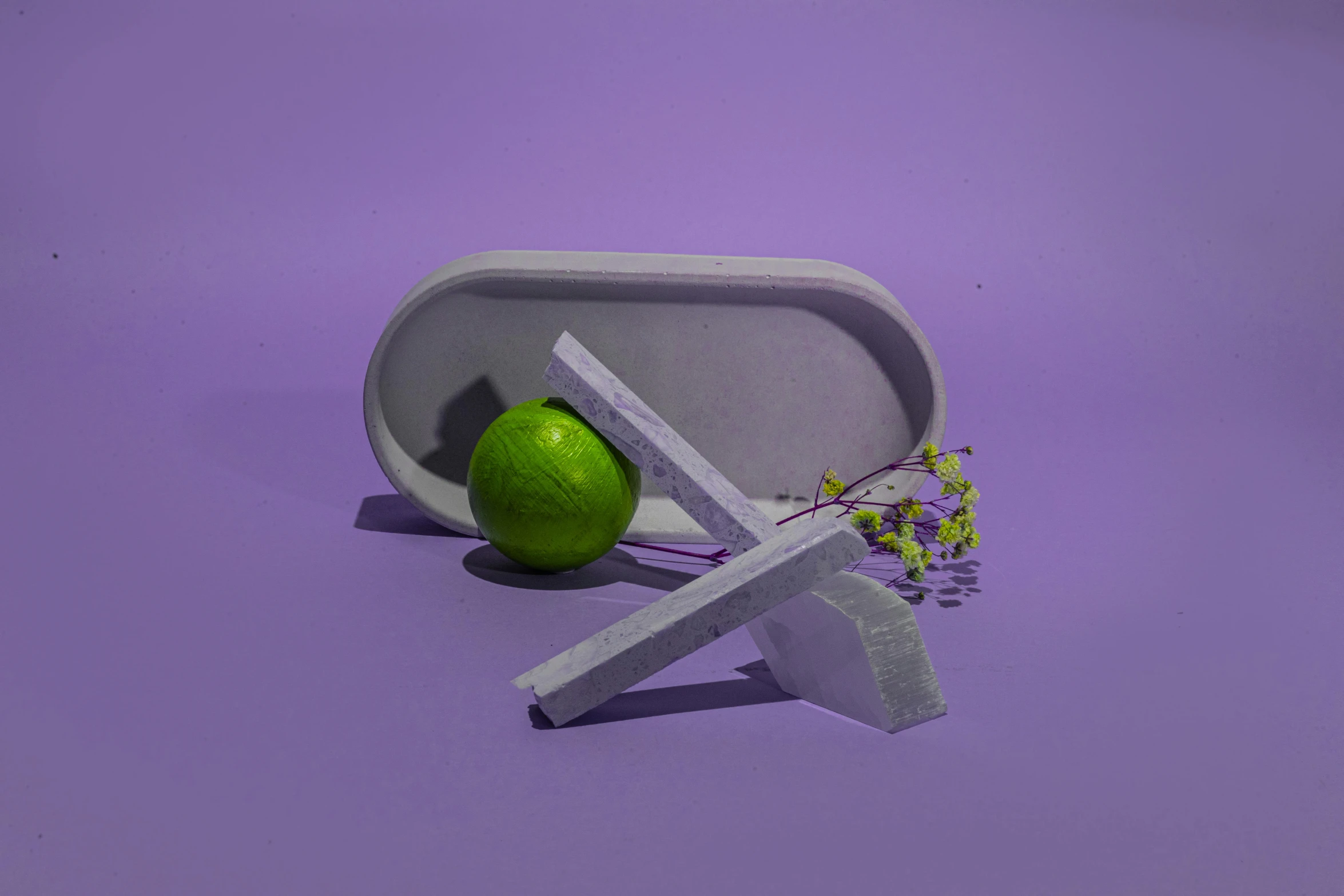 a green apple sitting on top of a white object, an abstract sculpture, inspired by Isamu Noguchi, unsplash, concrete art, lime and violet, carrying a tray, full product shot, rectangle