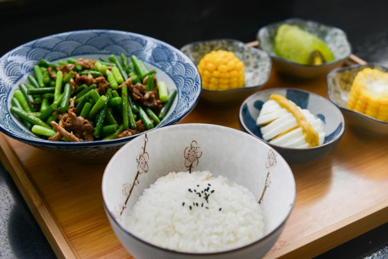 a wooden cutting board topped with bowls of food, a picture, shin hanga, avatar image