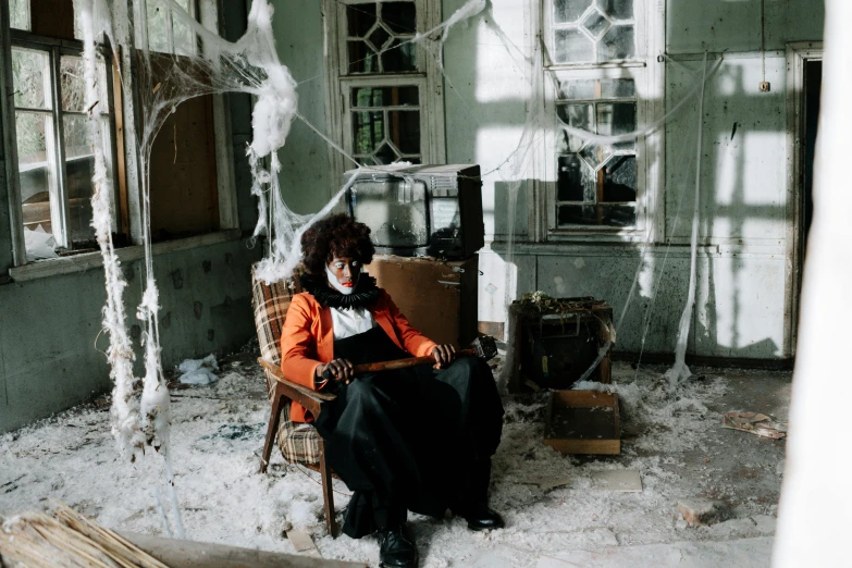 a woman sitting in a chair covered in snow, an album cover, pexels contest winner, vanitas, inside a haunted destroyed house, black man with afro hair, cinematic outfit photo, halloween decorations