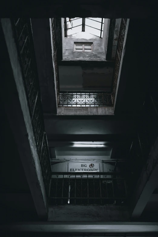 a black and white photo of a stairwell way, inspired by Elsa Bleda, unsplash contest winner, the cyberpunk apartment, ceiling hides in the dark, an escape room in a small, gray concrete