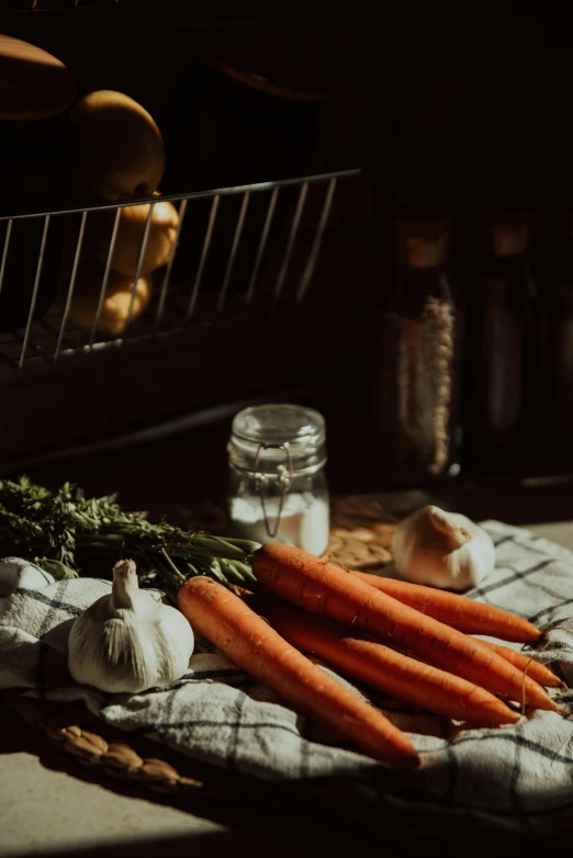 a bunch of carrots sitting on top of a table, a still life, pexels contest winner, near kitchen stove, warm light, local foods, winter