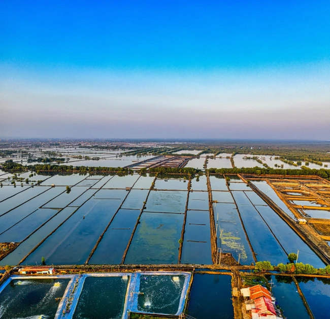 a large body of water filled with lots of water, unsplash contest winner, farms, patiphan sottiwilaiphong, opposite of urban sprawl, slide show