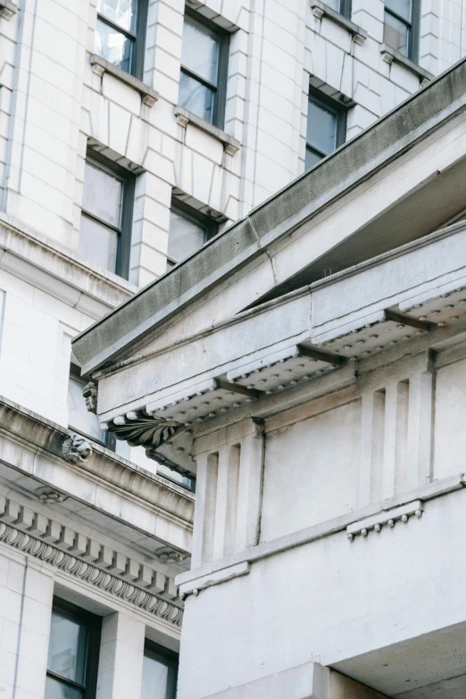 a clock that is on the side of a building, inspired by Rachel Whiteread, unsplash, neoclassicism, awnings, large cracks, intricate detailed roof, 1910s architecture