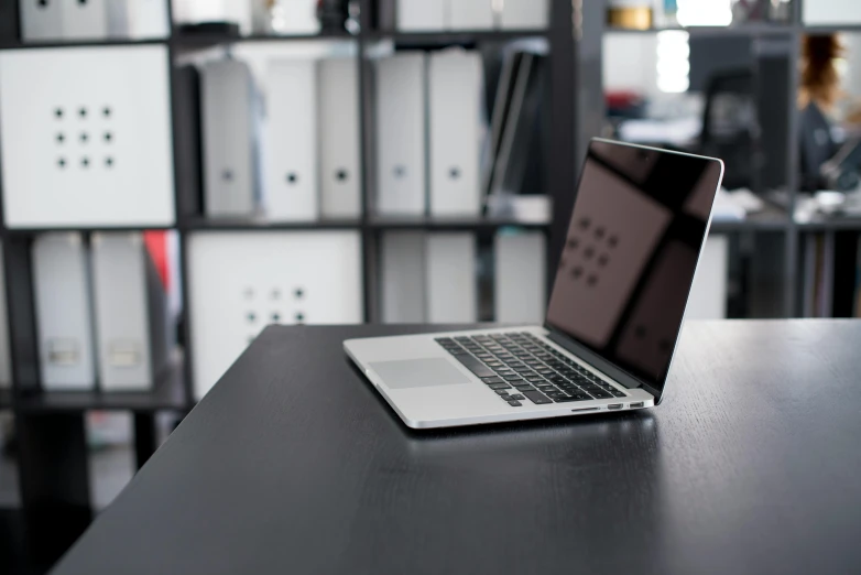 a laptop computer sitting on top of a wooden desk, by Tom Bonson, unsplash, government archive, full body image, office furniture, black interface