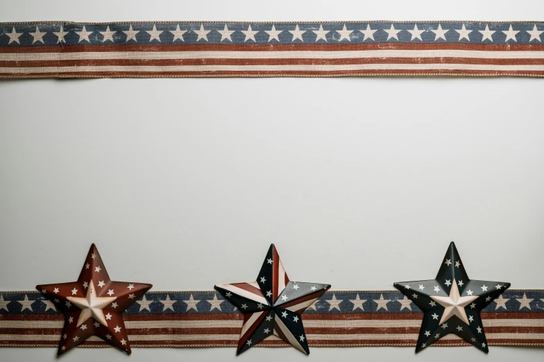 a row of stars sitting on top of an american flag, pexels, paper border, background image, high-quality wallpaper, tape