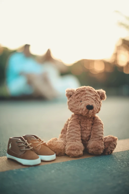 a teddy bear sitting next to a pair of shoes, a picture, pexels contest winner, late afternoon, paul barson, mini model, fatherly