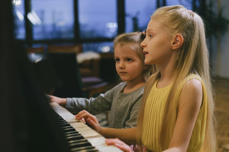 two little girls are playing a piano together, by Nick Fudge, danube school, 15081959 21121991 01012000 4k, lachlan bailey, looking across the shoulder, blonde