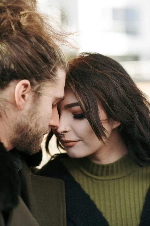 a man and a woman standing next to each other, trending on pexels, messy brown hair, romantic lead, upclose, bearded