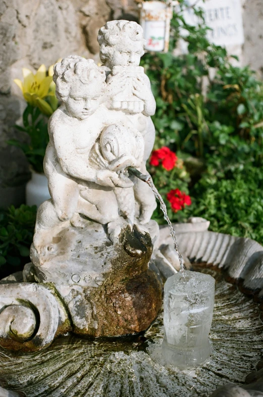 a water fountain with a statue on top of it, cherub, al fresco, comforting and familiar, platinum