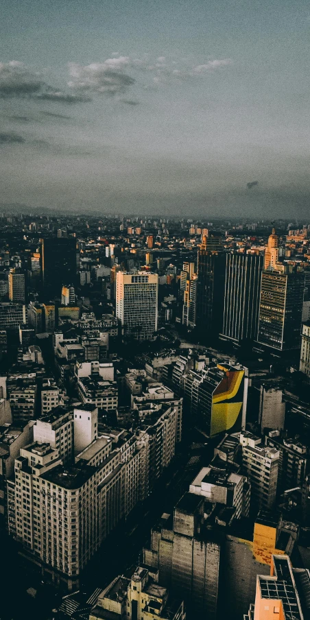 a view of a city from the top of a building, an album cover, by Matteo Pérez, pexels contest winner, modernism, mexico city, ominous background, indonesia, panorama