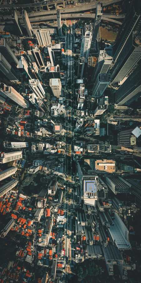 an aerial view of a city with tall buildings, an album cover, unsplash contest winner, highly detailed 8k photo, looking up, instagram post, concrete jungle