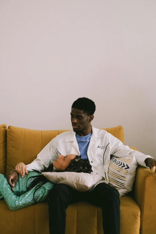a man and a woman sitting on a couch, by Jessie Alexandra Dick, pexels contest winner, healthcare worker, tyler the creator, ignant, (doctor)