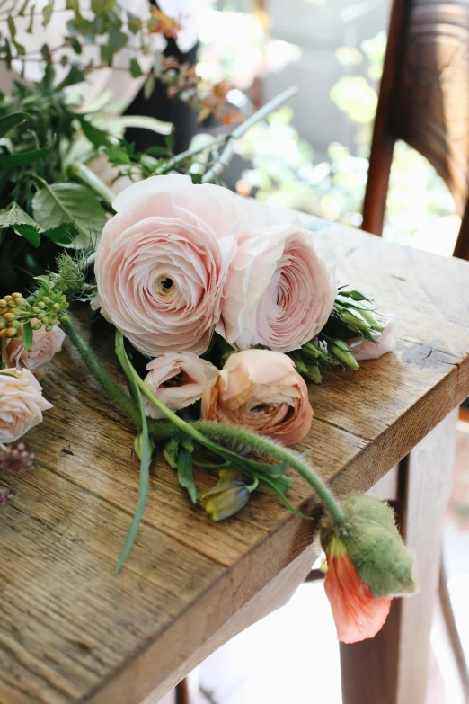 a bunch of flowers sitting on top of a wooden table, upclose, displayed, tabletop, multiple details