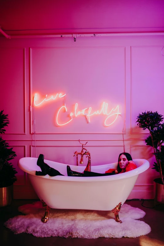 a woman laying in a bathtub under a neon sign, inspired by David LaChapelle, trending on pexels, standing in corner of room, ariana grande photography, cheery, insanely cute