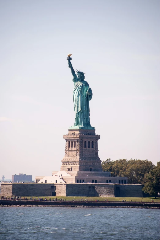 a view of the statue of liberty from across the water, exterior photo, taken in the late 2000s, waist high, instagram photo