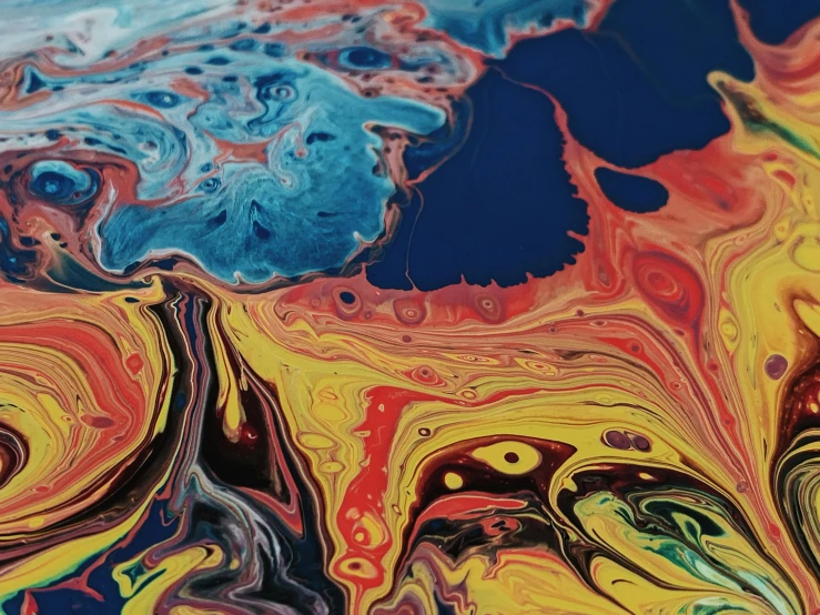 a close up of a painting on a table, trending on pexels, action painting, swirling liquids, lsd waves, abstract album cover, multicoloured